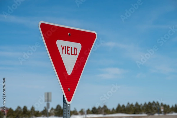 Obraz yield sign with blue sky
