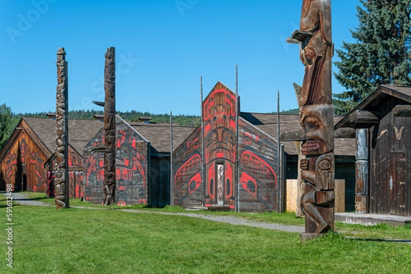 Fototapeta Traditional long houses and totem poles of the Gitxsan or Ksan First Nations natives, Old Hazelton, British Columbia, Canada.