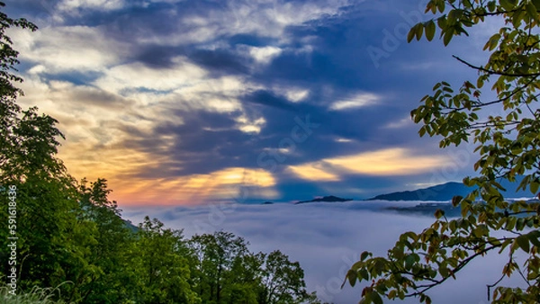 Obraz sunrise over the clouds