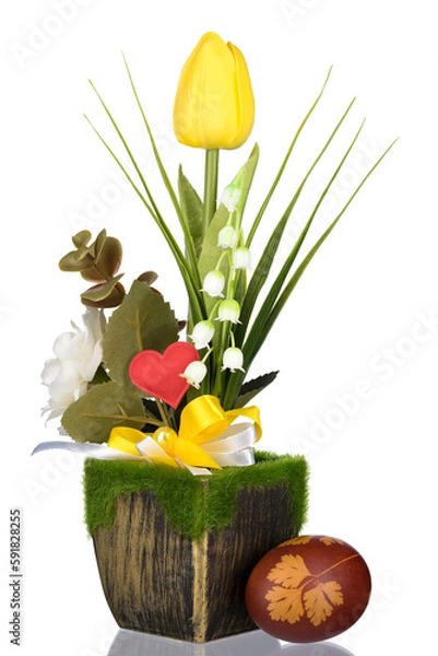 Obraz Easter egg. Yellow tulips in green can with light background.