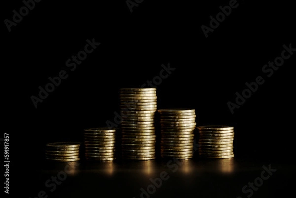 Fototapeta Stack of coins on black background, Saving money concept