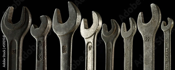 Fototapeta a set of eight wrenches of different sizes - on black