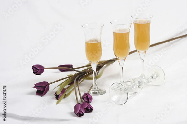 Obraz Artificial flowers and four wine glasses