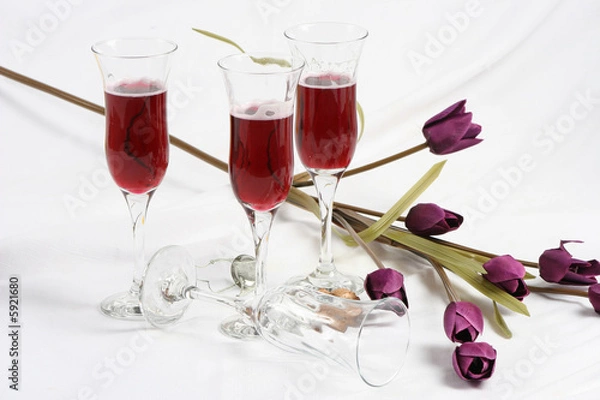 Obraz Artificial flowers and four wine glass