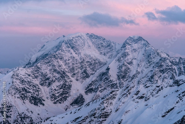 Obraz Snowy mountains at sunset. Beautiful landscape with snowy rocks