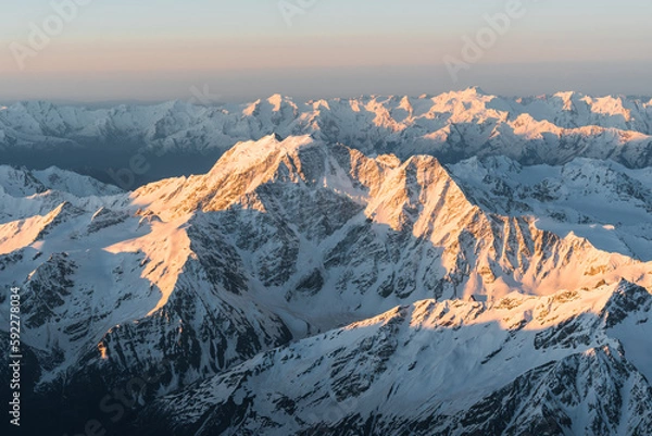 Obraz Snowy mountains at sunrise. Beautiful landscape with snowy rocks