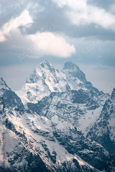 Obraz View of  Mount Ushba and snow-covered peaks on a cloudy day
