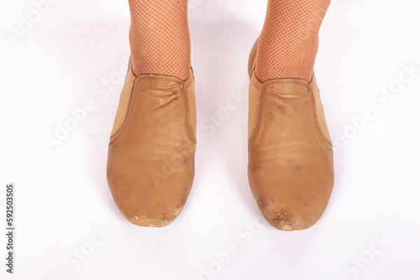 Fototapeta Tan Jazz INCORRECT standing feet position front on teacher perspective Close up of young female ballet dancer showing various classic ballet feet positions 