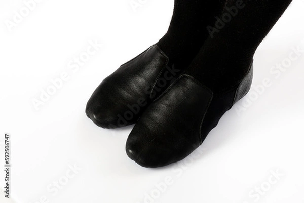 Obraz Black Jazz CORRECT standing feet position side on isolcated on white background Close up of young female ballet dancer showing various classic ballet feet positions for jazz ballet