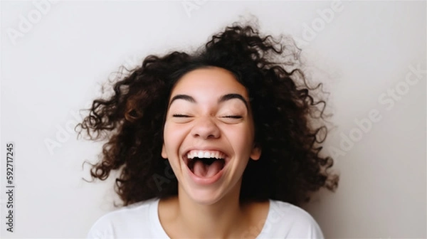 Fototapeta portrait of young woman with dark curly hair laughing showing teeth happy in front of white background, generative ai, illustration