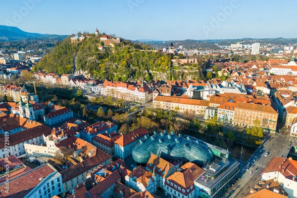 Fototapeta CIty of Graz in Austria on a sunny spring day with the landmark Schloßberg
