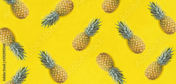 Fototapeta Pineapple on the yellow background. Flat lay. Pattern. Top view.