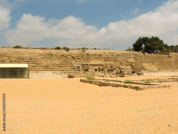 Fototapeta Caesarea Amphitheater in Caesarea National Park, which was originally built by King Herod and today is a famous archaeological site in Israel.  Image has copy space.