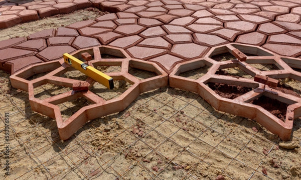 Fototapeta laying paving slabs using templates