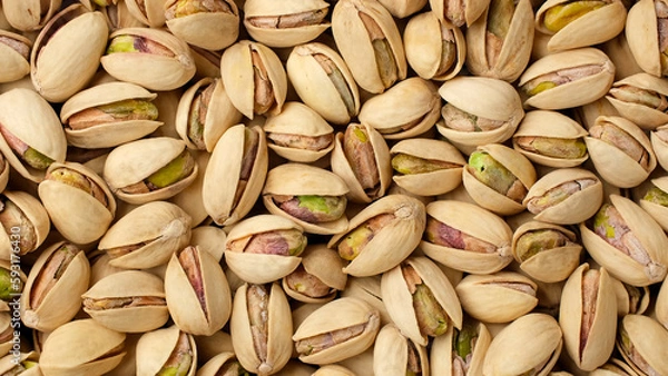 Obraz Salted roasted pistachios top view