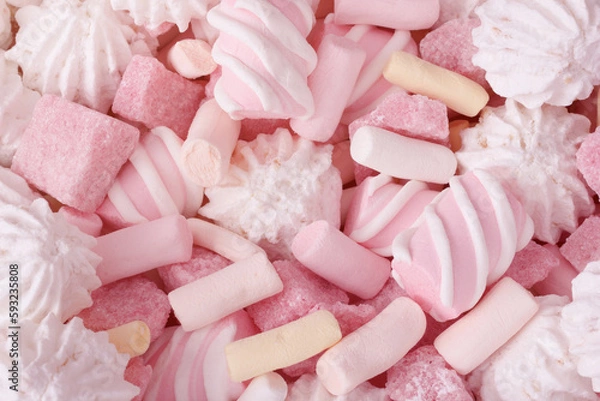 Fototapeta Macro of sweets with pink marshmallow, meringue cookies and strawberry sugar pieces