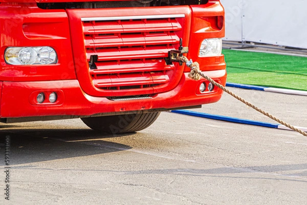 Fototapeta Towing a lorry with a rope