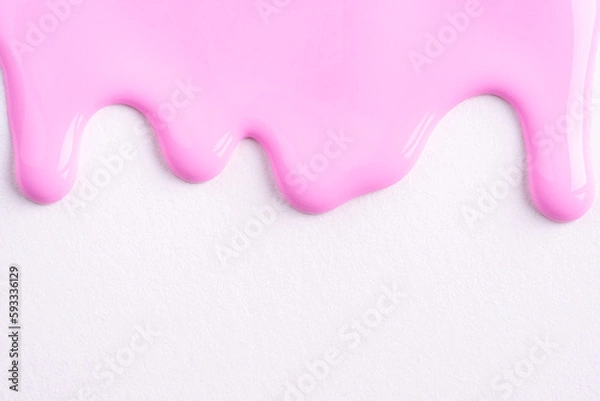 Obraz Pink liquid drops of paint color flow down on white canvas. Abstract art. Light pink paint dripping on the white wall with copy space..