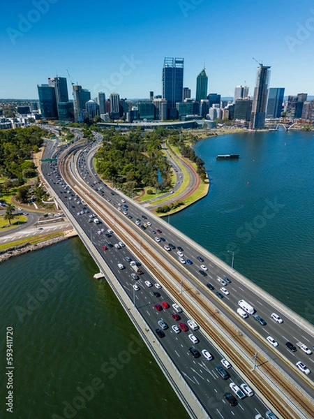 Fototapeta Vertical aerial shot of highway connecting to Perth CBD in Australia