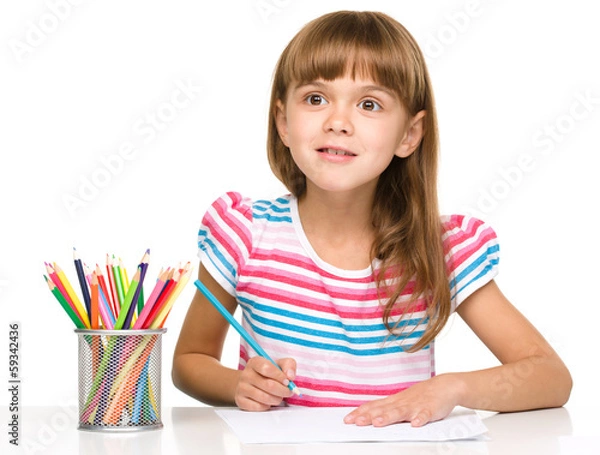 Obraz Little girl is drawing using pencils