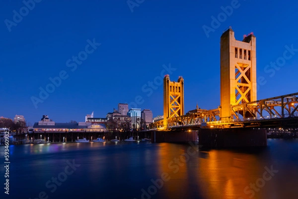 Fototapeta A view of Tower Bridge in Sacramento, CA from River Walk Park at dusk
