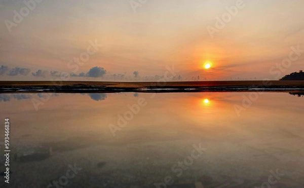 Obraz Sunrise at the beach with reflection
