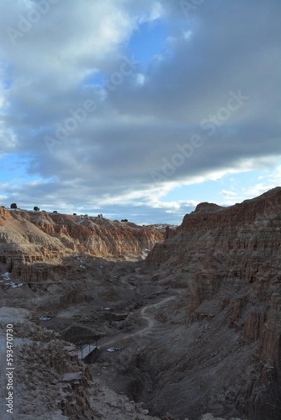 Fototapeta Cathedral Gorge State Park on a cold day in December with fresh snow, located in a long, narrow valley in southeastern Nevada, where erosion has carved patterns in bentonite clay