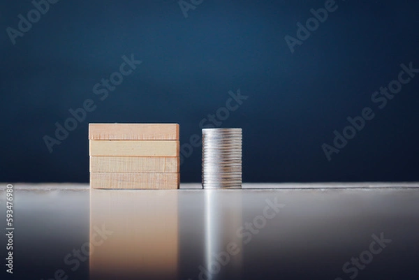 Obraz Wooden blocks and coins background for business text