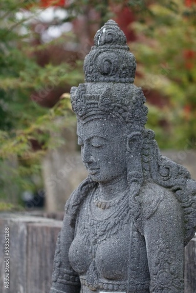 Fototapeta Vertical closeup shot of an Indian Goddess statue found in a garden