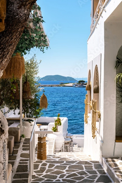 Fototapeta Gateway to the sea in a Greek cafe.