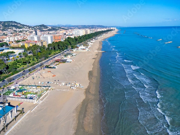 Fototapeta Aerial view landscape Italy Pescara. Long empty beach, sand, sea. Coast, promenade, buildings, estate.