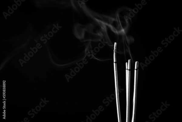 Obraz Incense sticks and incense stick smoke on black backgrond with white backlit