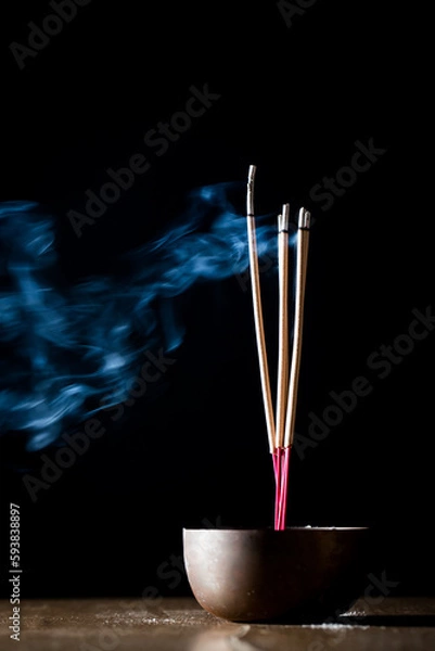 Obraz Incense sticks and incense stick smoke on black backgrond with white backlit