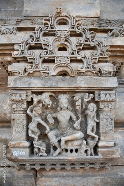 Fototapeta Carved stone idols on the outer wall of The Harshat Mata Temple, a Hindu temple dedicated to a goddess Harshat Mata, Abhaneri, Rajasthan, India