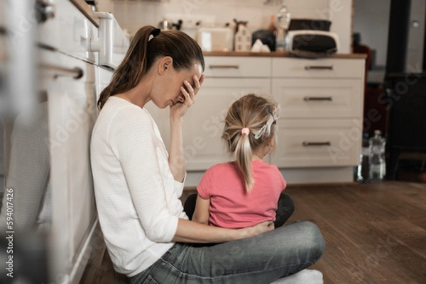 Obraz Tired exhausted mother at home taking care of child 