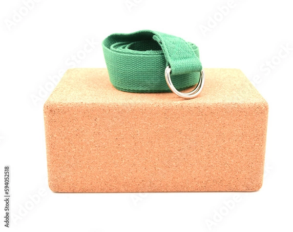 Fototapeta One cork yoga block and green strap isolated on a white background