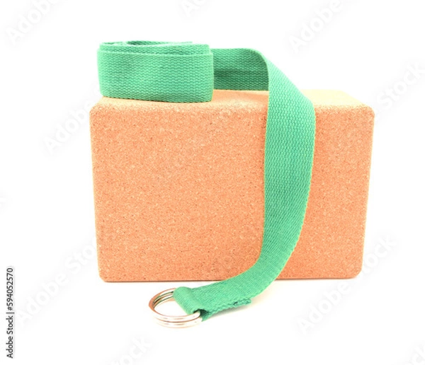 Fototapeta One cork yoga block and green strap isolated on a white background