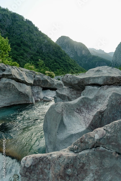 Fototapeta The river Valbona infront of the Albanian Alps in Valbona, Albania.