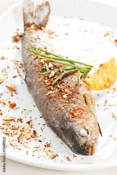 Fototapeta trout fish baked with nuts