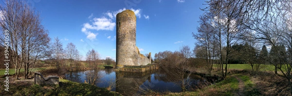 Fototapeta Medieval ruin of Baldenau castle with its tower and moat in early spring