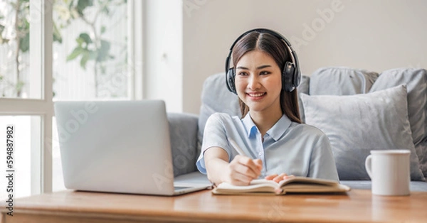 Fototapeta Asian girl student online learning class study online video call zoom teacher, Happy asian girl learn english language online with computer laptop..