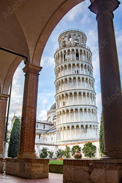 Obraz Leaning tower of Pisa, Italy, framed in the unusual perspective of the arches and columns