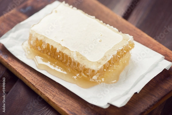 Fototapeta Honeycomb, rustic wooden background, horizontal shot