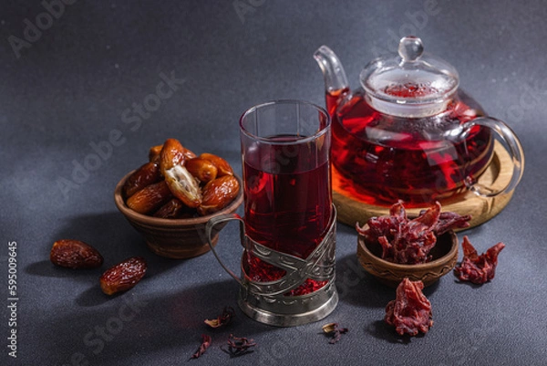 Fototapeta Hibiscus hot tea with dates. Traditional Ramadan Kareem concept snack for Iftar or Suhoor meal