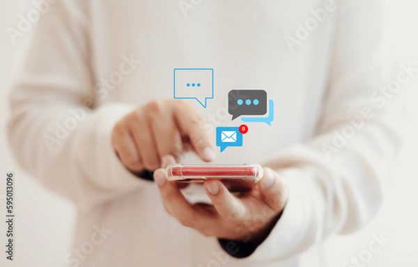 Fototapeta Notification concept, businessman holding smartphone touch white newsletter like e-mail