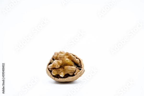 Fototapeta Walnuts in a shell on a white background