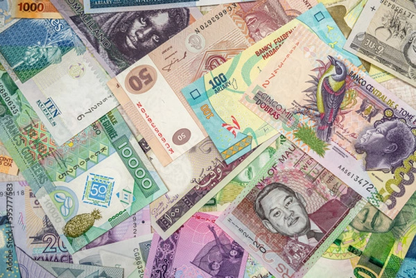 Fototapeta African money are scattered on the table so that it is completely covered.