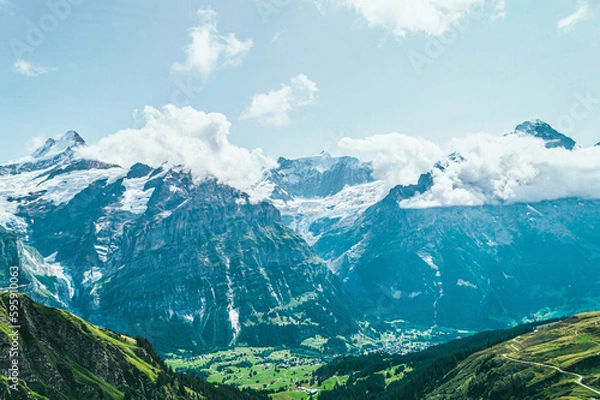 Fototapeta Summer mountain landscape with green grass and mountain peaks.