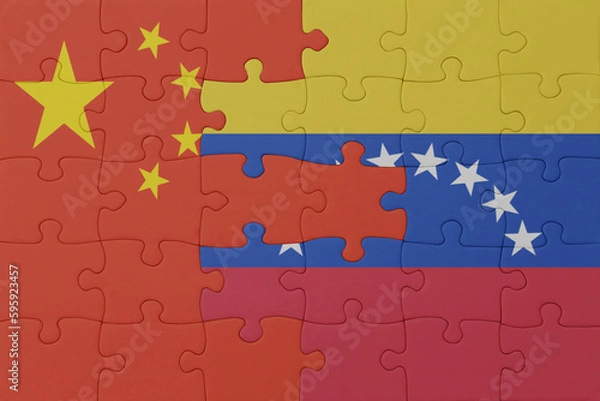Fototapeta puzzle with the national flag of venezuela and china . macro.concept.