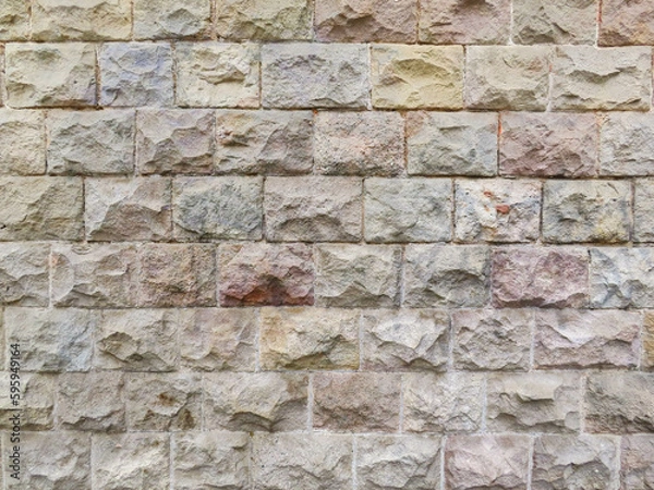 Fototapeta Textured stone sandstone surface. Close up image bricks